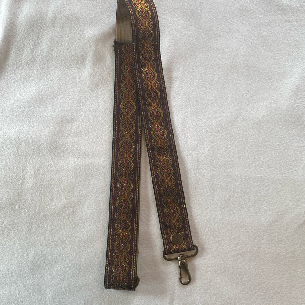 Soretro guitar style purse strap.